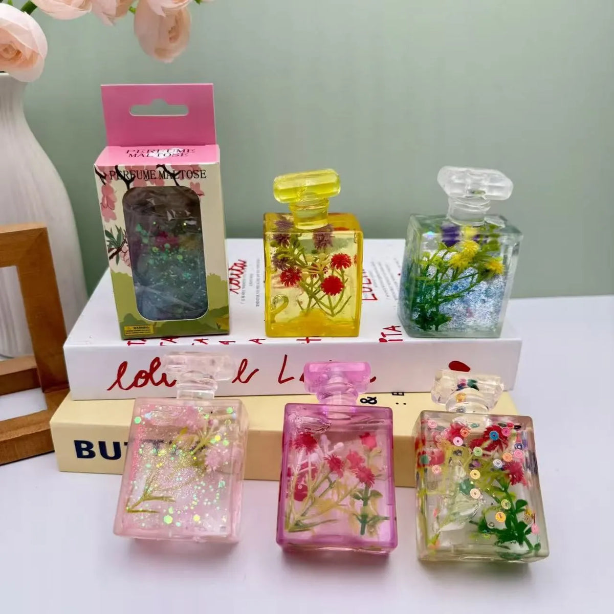 Glitter Flower Perfume Bottle Squishy – Stress Relief Toy